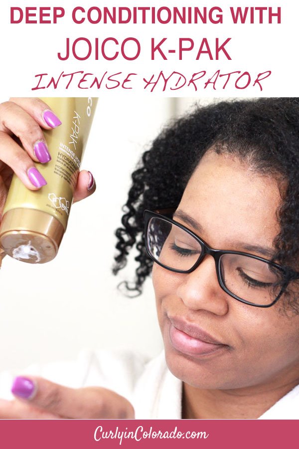 woman with natural hair using conditioner